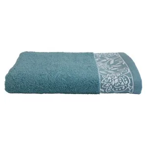 Toalla tocador de 450 gm, diseño cenefa jacquard, color azul verdoso, ALMEIDA.